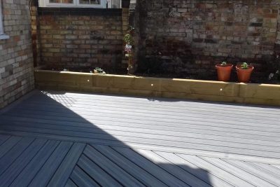 Planters alongside composite decking